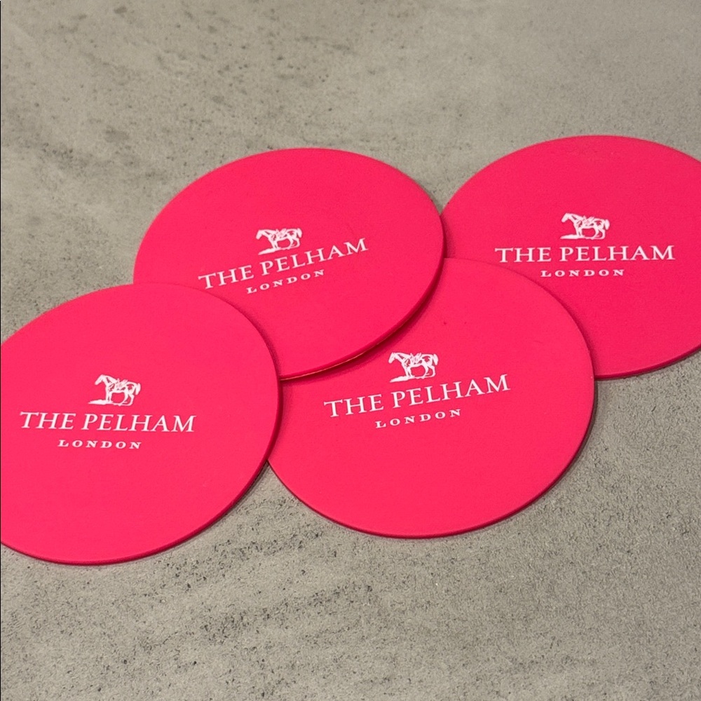 NWOT THE PELHAM LONDON BOUTIQUE HOTEL PINK RUBBER COASTERS SET OF 4